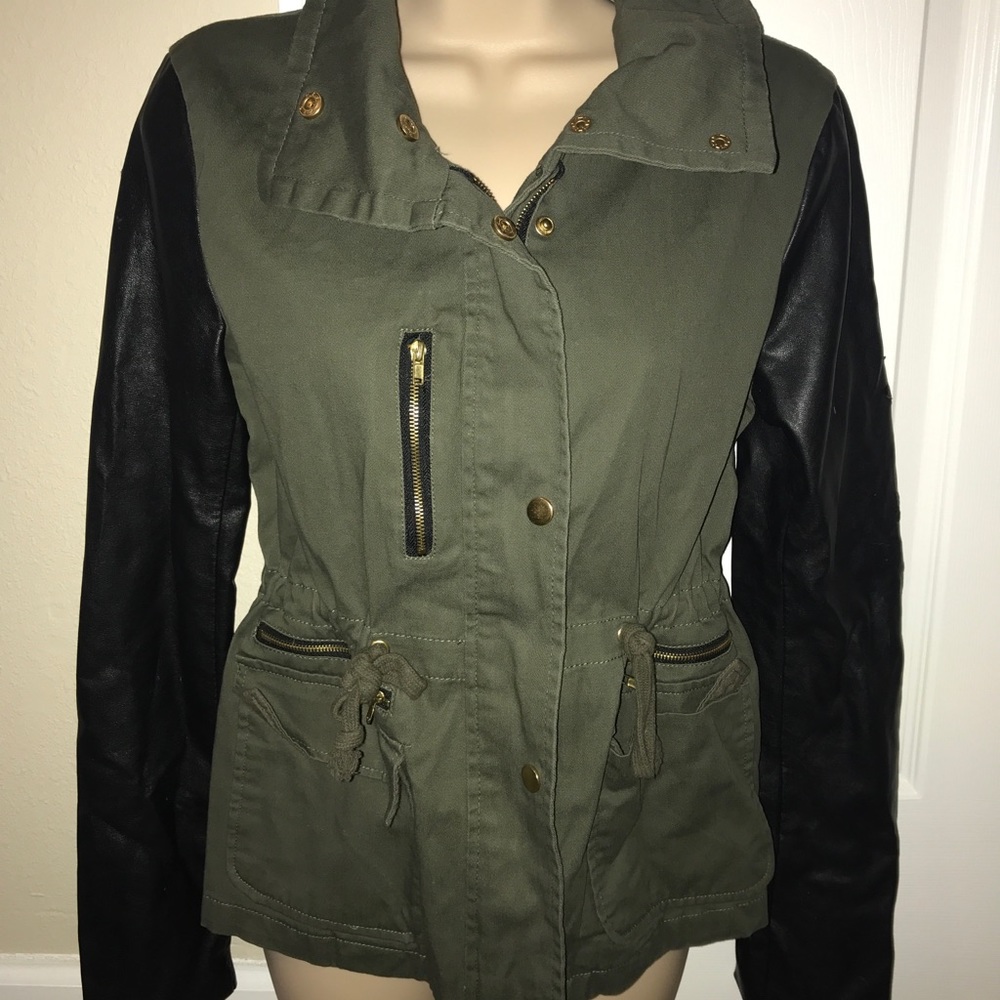 Forest green cargo jacket with leather sleeves.